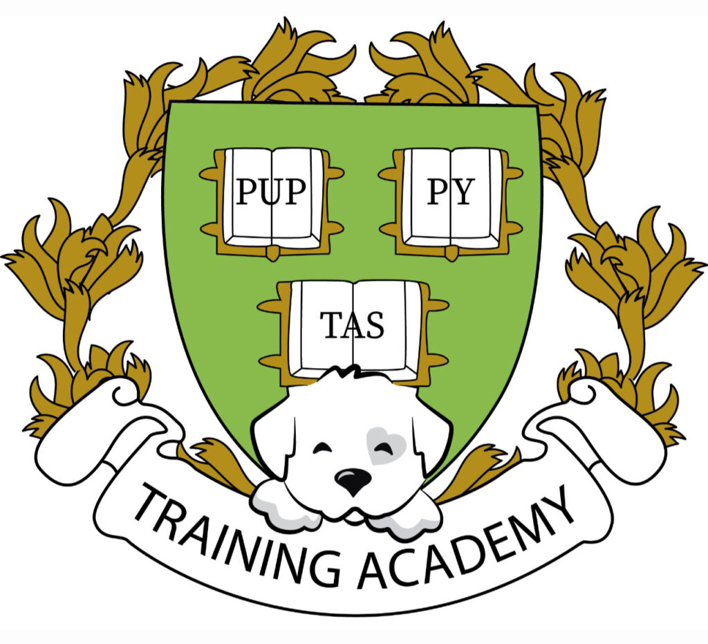 Our training academy crest. A dog leaning on banner text that reads "training academy" with a green crest with open books on it behind him.